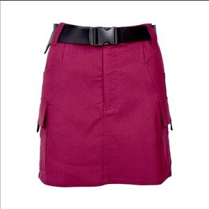 Utility skirt with buckles on side pocket